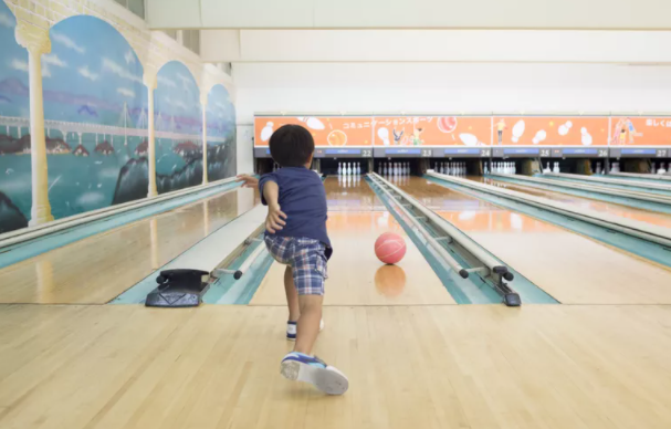 A kid Bowling